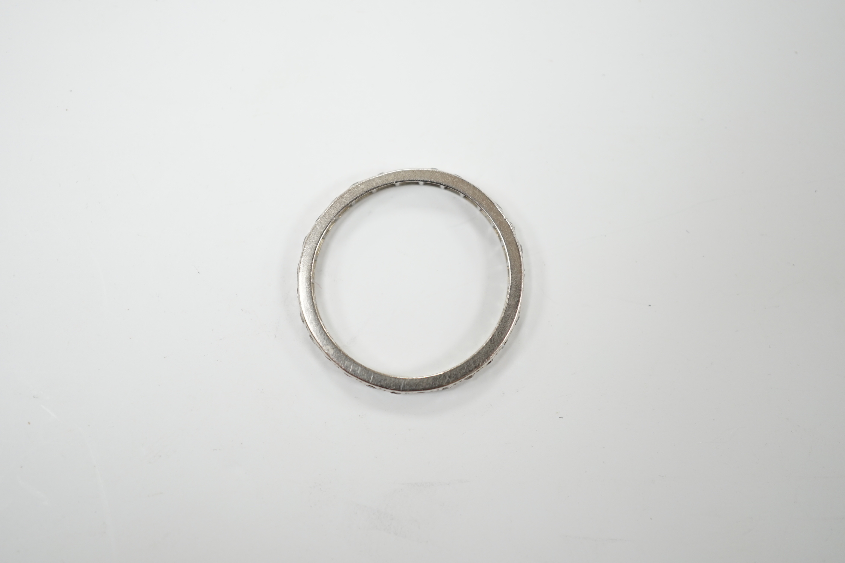 An early 20th century white metal diamond set full eternity ring, size O
